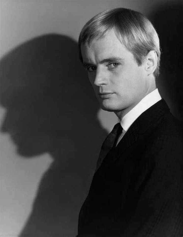 David McCallum is looking at the camera in a black and white picture.