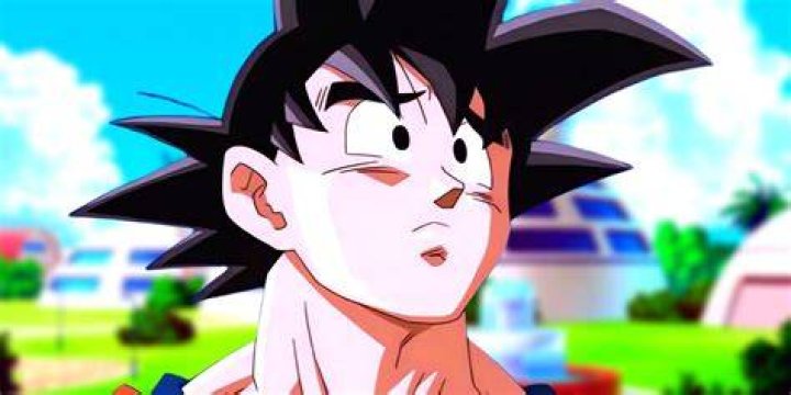 Goku is looking at the camera from the side.