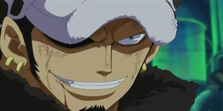 Trafalgar Law smiling with the sea behind him in One Piece
